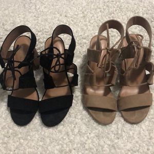Black and brown pair of lace up sandals